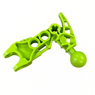 Bright lime green Bionicle arm piece with two circular connection ports, angular upper section, and ball joint connector at t