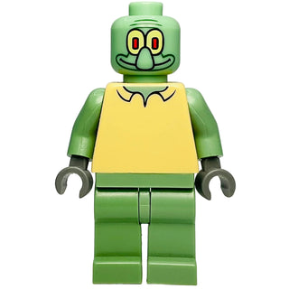 Green LEGO minifigure with yellow rectangular torso, large eyes with red pupils, pointed nose, and smiling expression.