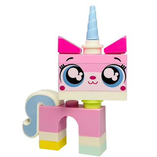 Pink and blue LEGO Unikitty minifigure with large eyes, magenta ears, spiral horn, and colorful body segments.