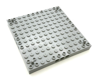Brick Modified 12x12 with 3 Pin Holes on each Side and Peg at each Corner, Part# 47976 Part LEGO® Light Bluish Gray  