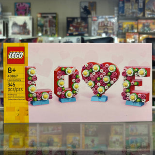 LEGO set 40867 box showing flower-decorated letters spelling "LOVE" with pink, red, and yellow blooms.
