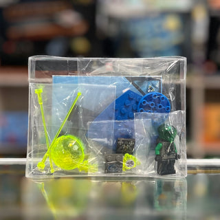 LEGO space set containing blue spacecraft, yellow alien figure, green minifigure, and accessories in clear display case.