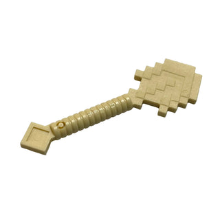 Tan plastic minifigure shovel with pixelated square blade and textured handle grip.