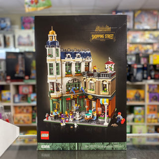 LEGO Icons Shopping Street set box featuring a detailed modular building with clock tower, storefronts, and minifigures.