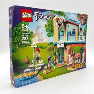LEGO Friends Heartlake City Vet Clinic set 41446 box showing yellow building with minifigures and animals.