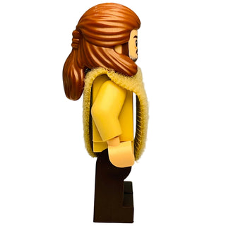 LEGO minifigure with brown hair and beard, yellow torso, tan poncho, and dark brown legs.