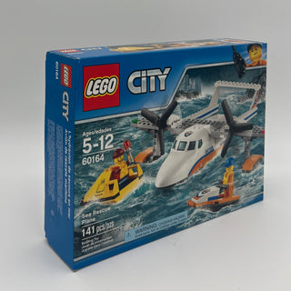 LEGO City Sea Rescue Plane set 60164 box containing white and orange aircraft, yellow rescue boat, and orange accessory piece