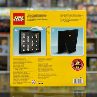 Black LEGO minifigure display frame with studs on front panel and stand, shown from front and back views on yellow packaging.