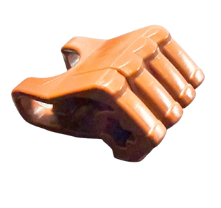 Orange and dark brown plastic fist with four fingers and axle hole connection point.