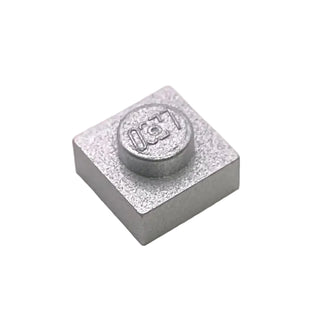 Small gray square plate with single centered stud and part number marking on top surface.