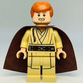 LEGO minifigure with reddish-brown hair, yellow tunic with black details, brown cape, and tan hands.