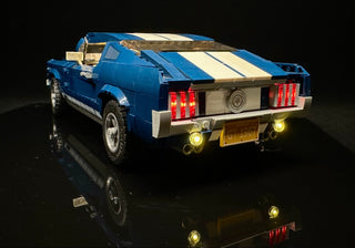 Blue and cream LEGO Ford Mustang GT with illuminated red taillights and yellow headlights and underglow.