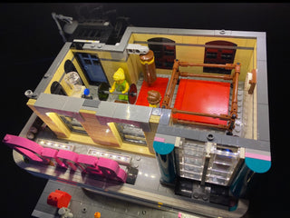 LEGO Downtown Diner set with illuminated LED lighting strips installed throughout the interior and exterior sections.