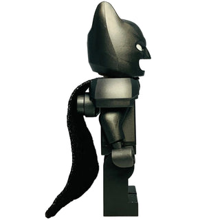 LEGO Batman minifigure with dark gray cowl, white eyes, armor torso, and black spongy cape.