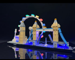London Skyline LEGO set illuminated with multicolor LED lights on towers, bridge, and base against dark background.