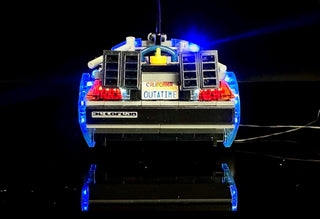 LEGO DeLorean time machine with blue underglow lights, red tail lights, and illuminated "California Outatime" license plate d