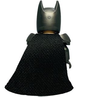 LEGO Batman minifigure with dark gray cowl, white eyes, pearl armor shoulders, and black textured cape.