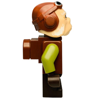 Brown and cream character figure with headphones, yellow-green limbs, and black base.