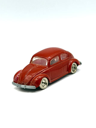 Dark red LEGO VW Beetle with white-wall tires and gray bumper, shown at three-quarter angle.