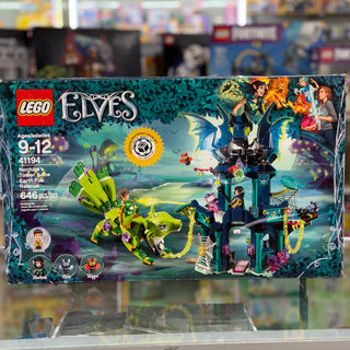 LEGO Elves set 41194 box showing teal tower structure, yellow fox creature, minifigures, and fantasy landscape scenery.