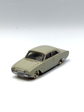 Light gray LEGO Ford Taunus sedan model car, 1/87 scale, with black windows and metallic wheels.