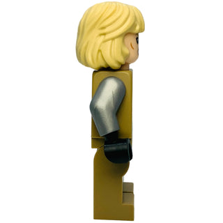 Minifigure with yellow short hair, tan torso, silver arm piece, and black hand on rectangular tan base.