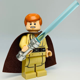 LEGO minifigure with orange hair, yellow tunic, brown cape, and light blue lightsaber.