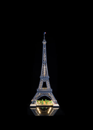 LEGO Eiffel Tower model with integrated LED lighting illuminating the structure and base garden section.