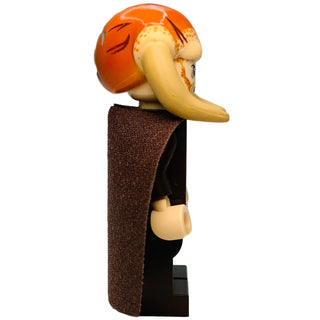 LEGO minifigure with orange head, long tan nose, brown cloak, and tan hands over black torso.