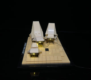 LEGO Sydney Opera House set with warm white LED lights illuminating the shell structures and base platform.