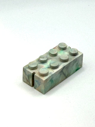 Gray rectangular brick with eight studs on top and opposite slot openings on sides.