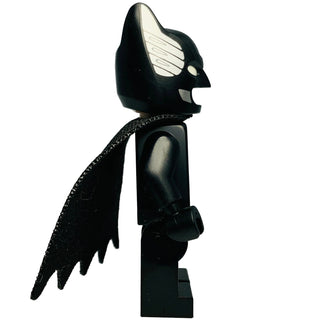 LEGO Batman minifigure with black suit, silver bat chest symbol, pointed cowl, and black cape.