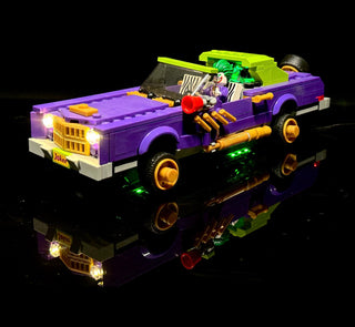 Purple and lime LEGO lowrider with illuminated headlights, undercarriage lights, and Joker minifigure with accessories.