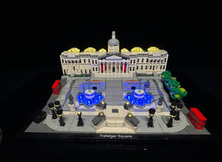 LEGO Trafalgar Square set with illuminated blue fountain lights and gold dome lighting on the building structure.