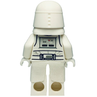 White minifigure with domed helmet, printed chest panel with dark blue details, and textured white legs with tan feet.