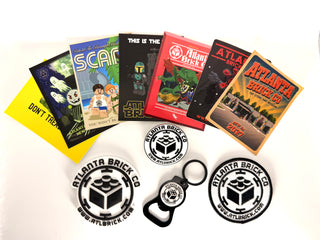 Collection of stickers and merchandise including six colorful branded stickers, three circular logos, one keychain, and one b