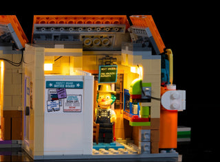 LEGO Krusty Burger building set with yellow LED lighting installed in interior and exterior sections.