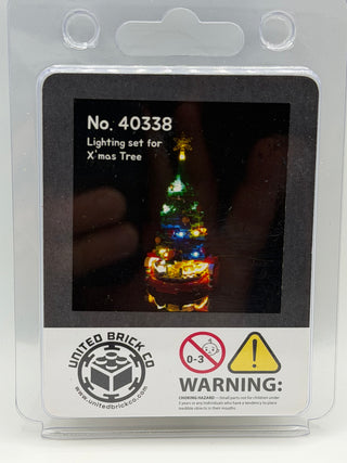 Lighting kit packaging showing illuminated LEGO Christmas tree with multicolored lights in clear plastic clamshell case.