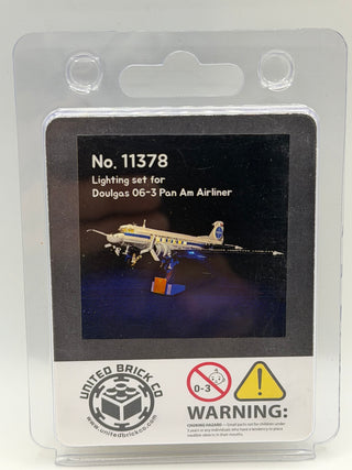Clear plastic clamshell package containing custom lighting kit for Douglas 06-3 Pan Am Airliner LEGO set with illuminated air