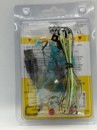 Custom LED lighting kit in clear blister packaging containing circuit board, wiring, and red LED components for LEGO set asse