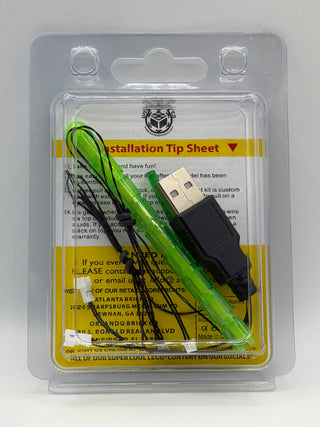 LED lighting kit with green wire and USB connector in clear plastic blister packaging with installation instructions.
