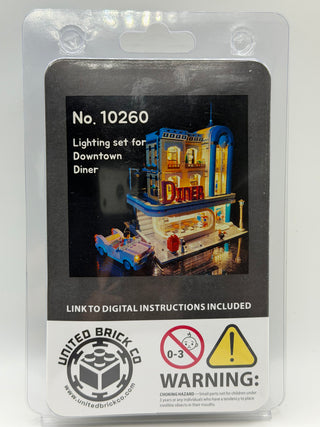 Blister pack packaging for LEGO lighting kit showing illuminated Downtown Diner building model with blue car.