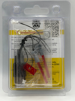 Custom lighting kit with black wires, red battery connector, and instruction manual in clear plastic blister packaging.