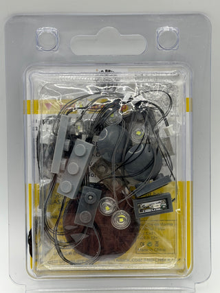 Custom lighting kit with multiple LED lights, wiring, and control module in clear blister packaging.