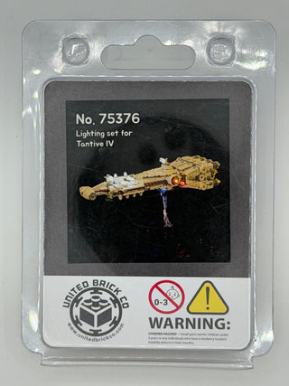 Clear plastic clamshell package containing lighting set for Tantive IV LEGO model with illustrated spacecraft and warning lab