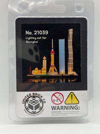 Packaging for Shanghai Skyline 21039 lighting kit displaying illuminated LEGO buildings including towers and skyscrapers on b