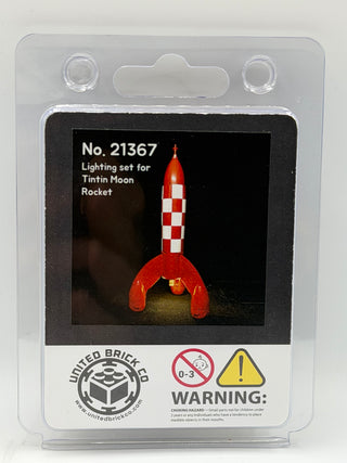 Clear plastic blister package displaying a red and white checkered LEGO rocket with illuminated interior against black backgr