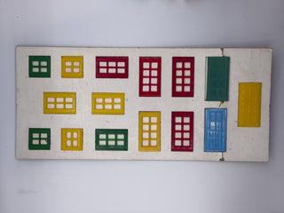 Card display showing twelve colorful window and door designs in green, yellow, maroon, and blue with grid patterns.
