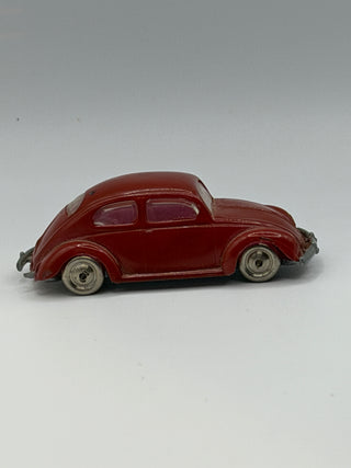 Dark red LEGO Beetle model car with silver wheels, shown in profile view against a neutral background.