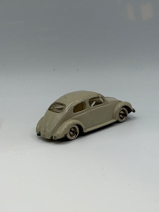 Light gray LEGO VW Beetle model in 1/87 scale with rounded body, small windows, and detailed wheels.